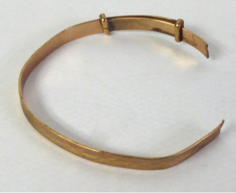 CHILD'S 9ct GOLD BANGLE, engine turned and with bright cut engraved design, 3.5 gms (as found)