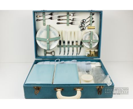 A vintage picnic set, including ceramic crockery, cutlery, etc., in hard case