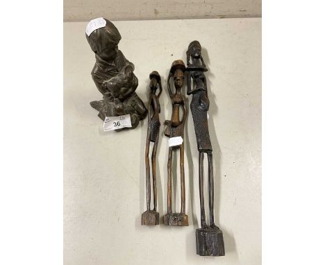 Mixed lot comprising three small East African hardwood figures together with a bronzed resin model of a boy with puppy