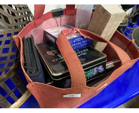 Bag of various artists paints, sketch pads, brushes and other accessories
