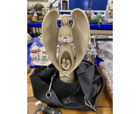 Composition model of an angel and a handbag