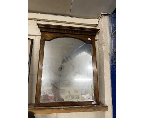Wall mirror in architectural frame