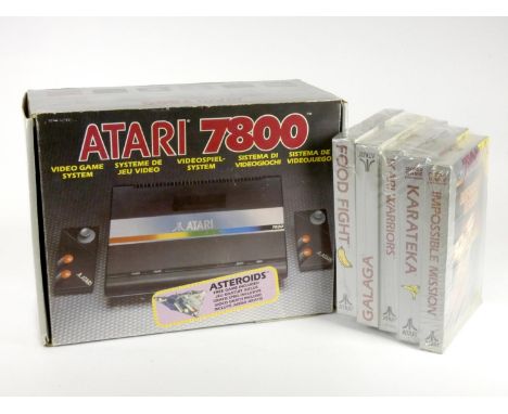 An Atari 7800 (serial No X9383805149), original box, AV and power cables, Asteroids manual (built in game on the Atari 7800),