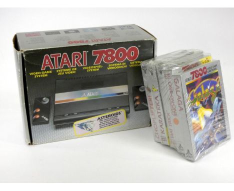 An Atari 7800 (serial No X9383806717), original box, AV and power cables, Asteroids manual (built in game on the Atari 7800),