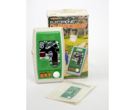 A Tandy Electronic Championship Golf handheld electronic game, original box, manual and polystyrene insert 