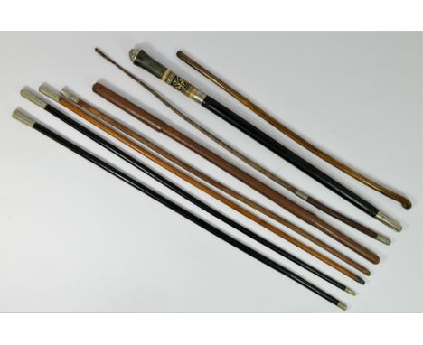 A swagger stick with West Yorkshire Regimental crest, three other swagger sticks with crests and four other sticks (8) 