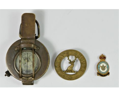 A British Military brass prismatic hand held compass, by Ross, London, broad arrow, together with a Lovat's Scouts cap badge 