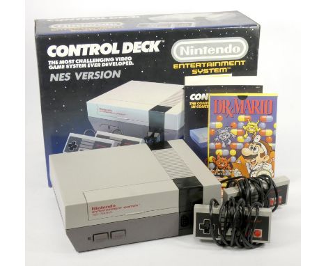 A Nintendo NES, console, two joypads, AV and power cables, with manuals, original box and polystyrene insert, together with a