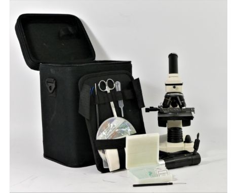 A Bresser Biolux NV microscope, carry case, power cable, lens, tools, accessories, slides and shoulder strap 