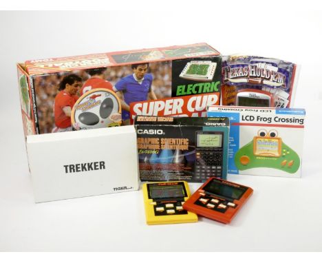 A Tomy Super Cup Football table top game, together with six hand held electronic games, to include Space Creature, Radio Shac