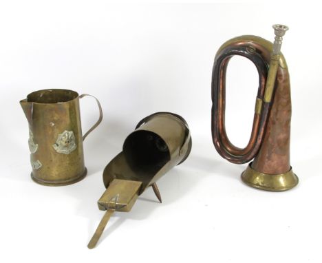 A WWI British Army copper and brass bugle by Boosey &amp; Co, 1916, Broad Arrow, a trench art brass jug from a 1916 18 PR II 