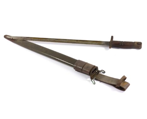 A WWI American Remmington bayonet, dated 1917, stamped U.S. and 25 original leather and steel mounted scabbard with its leath