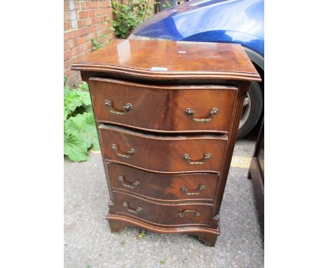A small reproduction mahogany, serpentine fronted chest of four long drawers, standing on bracket feet, 30" h x 19" w 