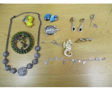 Costume and designer jewellery to include an A&amp; S knot brooch, a Sardi turtle brooch, Butler and Wilson, Monet earrings, 