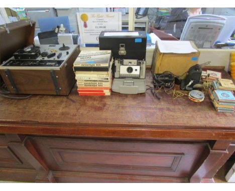 A Polaroid Automatic 103 land camera, in a case with accessories, An Astor Junior home cinema, 9.5mm with various films and a