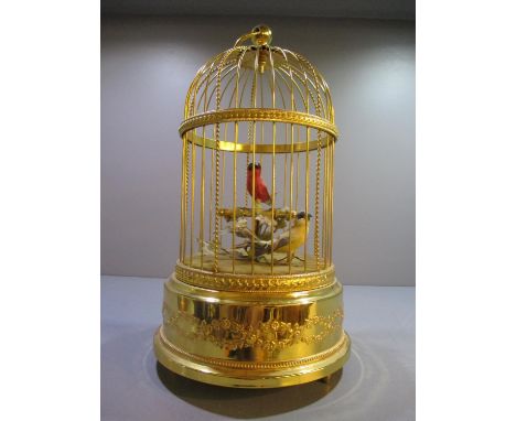 A Reuge music automaton of tow birds in a domed, gilded cage, A/F 