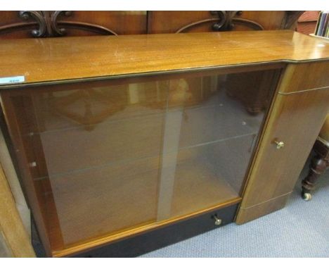 A Sapele and black finished G-Plan bookcase with internal glass shelf 