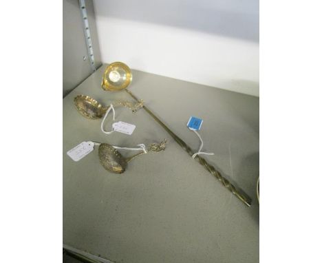 A George II silver toddy ladle with whale bone handle and silver shilling inset to the bowl, dated 1758 and two Dutch silver 
