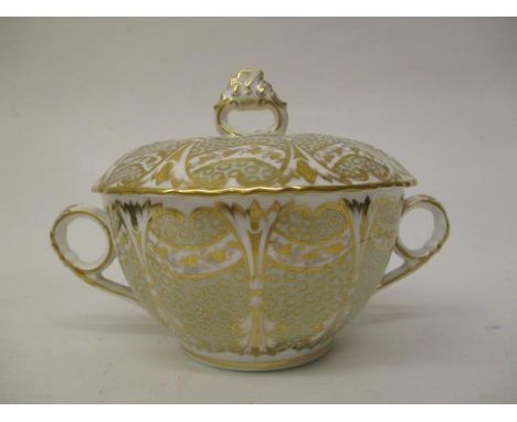 A 19th century Davenport lidded sugar bowl with twin loop handles decorated in gilt and pale green on a white ground, 4 1/2" 