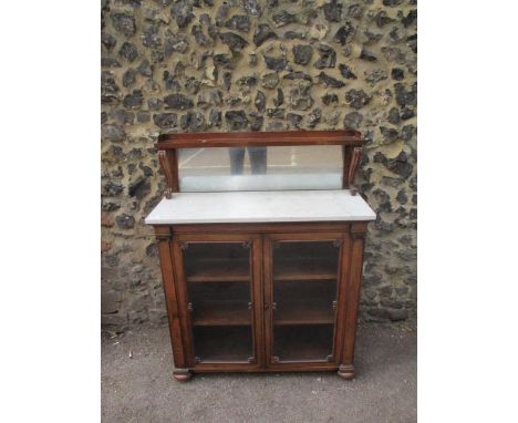 A Regency rosewood chiffoniere with a galleried shelf over a mirrored back, scrolled supports and a mottled white marble top,