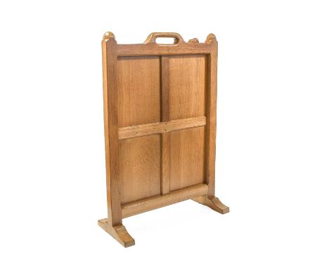 Workshop of Robert Mouseman Thompson (Kilburn): An English Oak Panelled Fire Screen, the frame with carrying aperture handle,