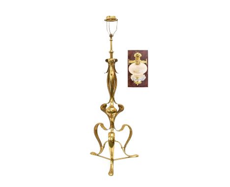 An Arts &amp; Crafts Brass Telescopic Standard Lamp, circa 1900, with fluid scroll decoration and hammered surface, unmarked,