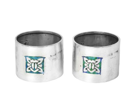 Archibald Knox (1864-1933) for Liberty &amp; Co., London: A Pair of Arts &amp; Crafts Silver and Enamel Napkin-Rings, Birming