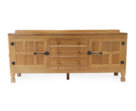 Workshop of Robert Mouseman Thompson (Kilburn): An English Oak 6ft Sideboard, 1975, with raised upstand, adzed top over two c