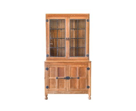Workshop of Robert Mouseman Thompson (Kilburn): An English Oak Drinks Display Cupboard, the leaded glazed upper section with 
