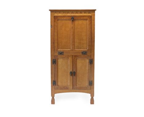 Gnomeman: Thomas Whittaker (1912-1991) (Littlebeck): A Panelled English Oak Drinks Cupboard, adzed top, above a dentil frieze