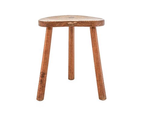 Workshop of Robert Mouseman Thompson (Kilburn): An English Oak Cow Stool, the kidney shaped seat on three octagonal legs, dat