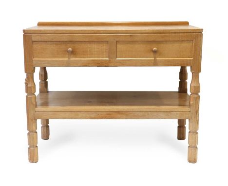 Workshop of Robert Mouseman Thompson (Kilburn): An English Oak Serving Table, 1981, with raised upstand, rectangular adzed to