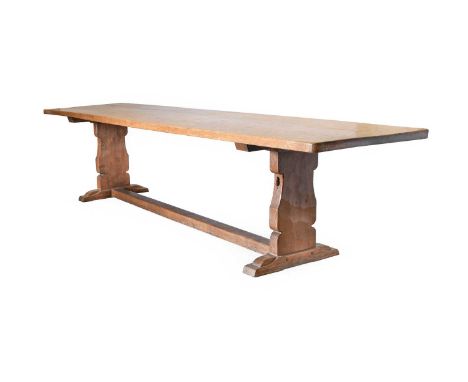 Robert Mouseman Thompson (1876-1955): An English Oak 10'6" Refectory Table, circa 1930, dowelled adzed three plank top, on tw