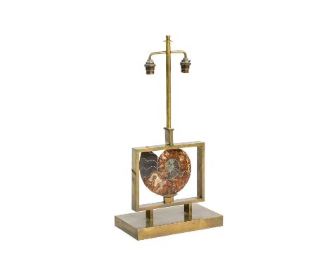A 1970s French Polished Ammonite Table Lamp, suspended in a brushed brass frame on a rectangular base, twin bulb holder, unma