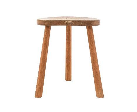 Workshop of Robert Mouseman Thompson (Kilburn): An English Oak Cow Stool, the kidney shaped seat on three octagonal legs, wit