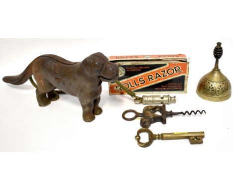 Various novelty items to include a cast iron nutcracker in the form of a dog, the mouth operated by lifting the tail, a corks