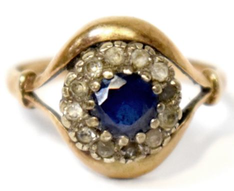 A 9ct yellow gold ladies dress ring, florally set with central blue stone and small white stone surround, size O, approx 3.2g