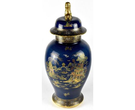 An early 20th century Carltonware lustre vase with cover, cobalt blue ground with hand painted all-over chinoiserie decoratio