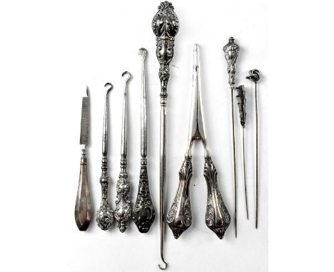 A collection of ladies' vanity and decorative items with hallmarked silver handles, to include four button hooks of various s