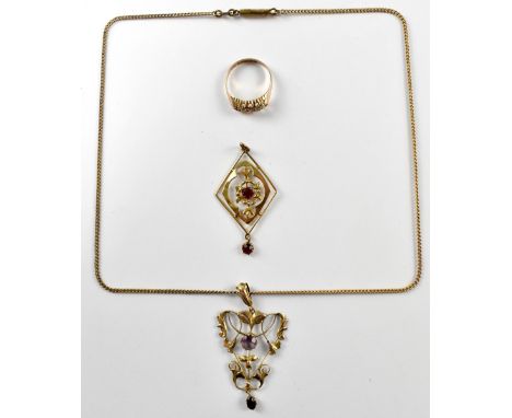 Two Edwardian style 9ct gold pendants one is set with small rubies the other is depicting scrolling leaves and set with ameth