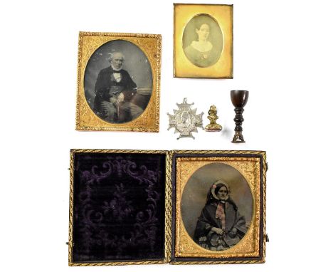 Three Victorian photographic plates, one in Moroccan leather and velvet lined gilded case of a Victorian lady, hand tinted, a