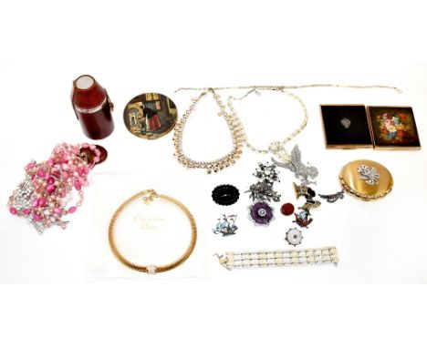 Various items of costume jewellery to include an early 19th century red gemstone brooch with horizontal carved stripes in gil