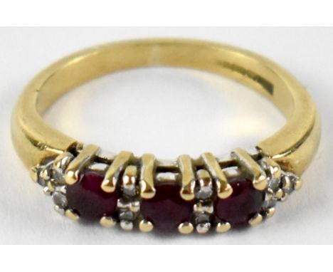 A 9ct yellow gold red topaz and diamond half eternity ring, size H, approx 2.3g.