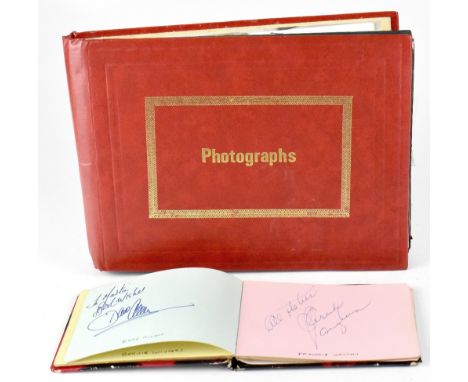 AUTOGRAPHS, VARIOUS; a large album containing mostly autographed promotional photographs to include Larry Grayson, Des O'Conn