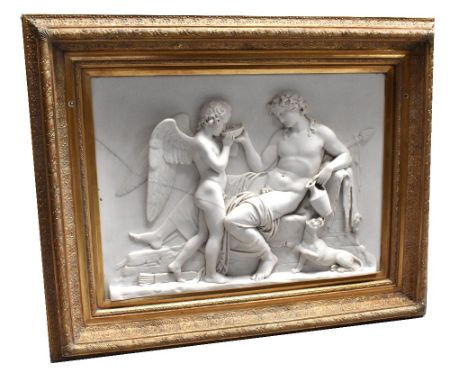 AFTER LOUIS ALEXANDRE BOTTEE; a large cast marble plaque depicting Cupid and Bacchus with inset bronze medallion to the rever