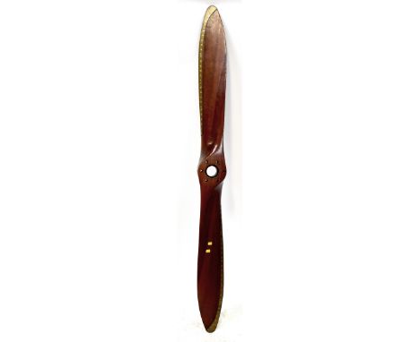 A vintage laminated wood aeroplane propeller from a Sidley Armstrong Genet engine, with brass-tipped twin blades, numbered 13