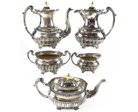 An Edward VII hallmarked silver five-piece tea service, teapot, coffee pot and hot water pot with ivory decorative knop and i