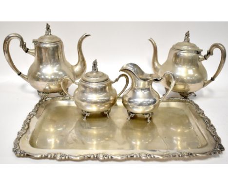 A Columbian silver (0900 grade) four-piece tea set comprising two teapots, a sucrier and a milk jug, the lids of the teapots 