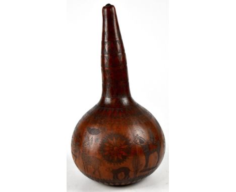 A bottle gourd with sgraffito decoration, abstract decoration to the top and around the centre maritime decoration of whales,