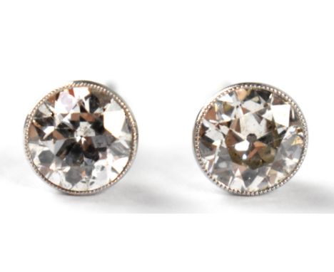 A vintage pair of 18ct white gold and 2ct diamond stud earrings, each earring collet set with a round brilliant cut diamond, 